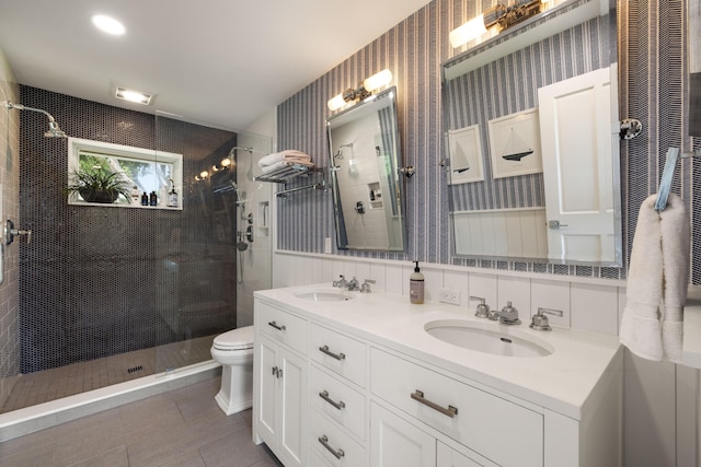 19100 SE County Line Rd, Jupiter, FL 33469 - bathroom featuring tiled shower, toilet, double vanity, tile patterned flooring, and wallpapered walls
