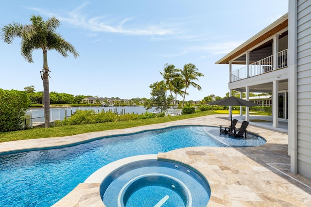 19100 SE County Line Rd, Jupiter, FL 33469 - view of swimming pool with a water view, a patio area, and a pool with connected hot tub