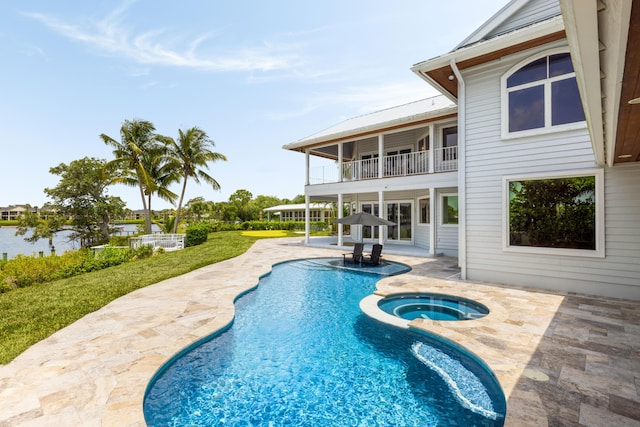 19100 SE County Line Rd, Jupiter, FL 33469 - view of pool featuring a patio and a pool with connected hot tub