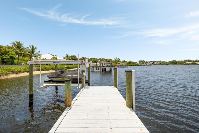 19100 SE County Line Rd, Jupiter, FL 33469 - dock with boat lift and a water view