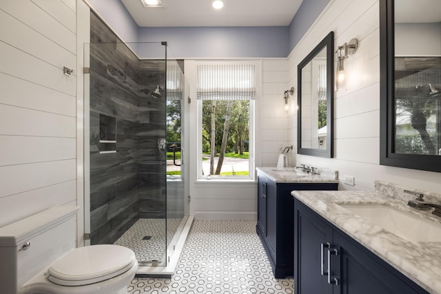 19100 SE County Line Rd, Jupiter, FL 33469 - bathroom with a shower stall, two vanities, and toilet