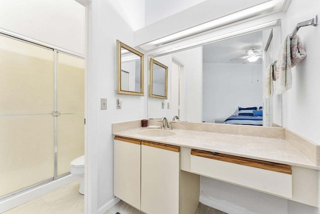 full bathroom with vanity, toilet, ceiling fan, connected bathroom, and a stall shower
