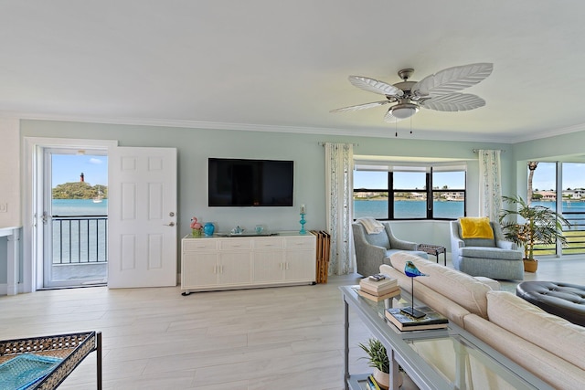 living area with crown molding and a ceiling fan
