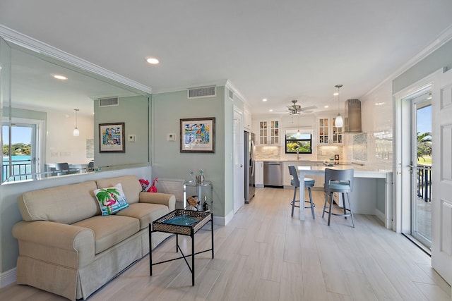 living room featuring recessed lighting, ceiling fan, visible vents, and light wood-style floors
