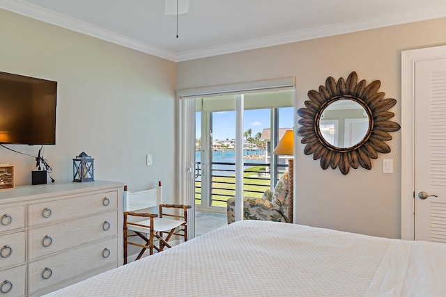 bedroom with a water view, ornamental molding, and access to exterior