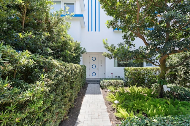 758 N St, West Palm Beach, FL 33401 - doorway to property with stucco siding