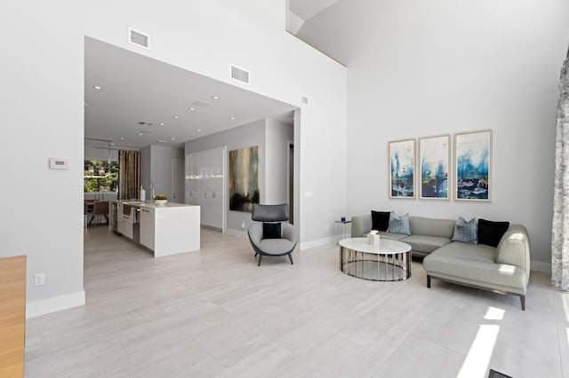 758 N St, West Palm Beach, FL 33401 - living area featuring a high ceiling, baseboards, and recessed lighting