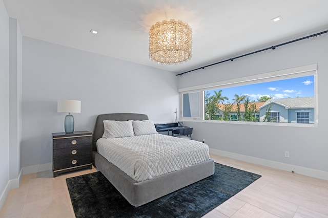 758 N St, West Palm Beach, FL 33401 - bedroom with a chandelier and baseboards