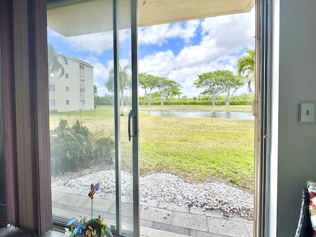 7145 Huntington Ln Unit 102, Delray Beach, FL 33446 - doorway to outside with a water view
