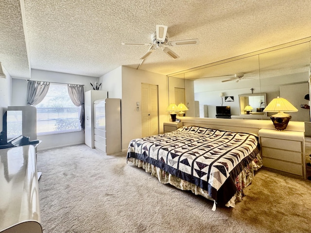 7145 Huntington Ln Unit 102, Delray Beach, FL 33446 - carpeted bedroom featuring a closet, a textured ceiling, and a ceiling fan