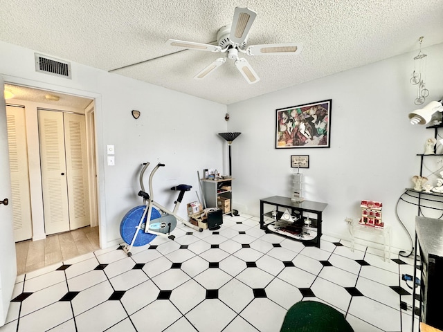 7145 Huntington Ln Unit 102, Delray Beach, FL 33446 - interior space featuring a ceiling fan, light floors, visible vents, and a textured ceiling