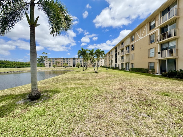 7145 Huntington Ln Unit 102, Delray Beach, FL 33446 - view of community featuring a water view and a yard