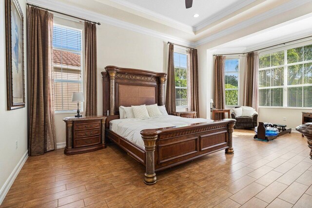 9481 Mcaneeny Ct, Wellington, FL 33414 - bedroom featuring wood finished floors, ornamental molding, baseboards, and ceiling fan