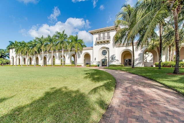 9481 Mcaneeny Ct, Wellington, FL 33414 - view of front of home with stucco siding, a front lawn, and decorative driveway