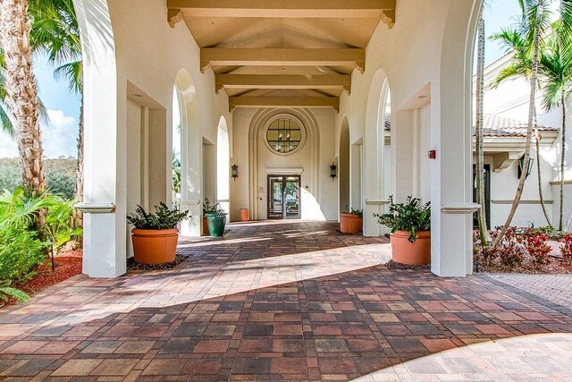 9481 Mcaneeny Ct, Wellington, FL 33414 - entrance to property with stucco siding and french doors