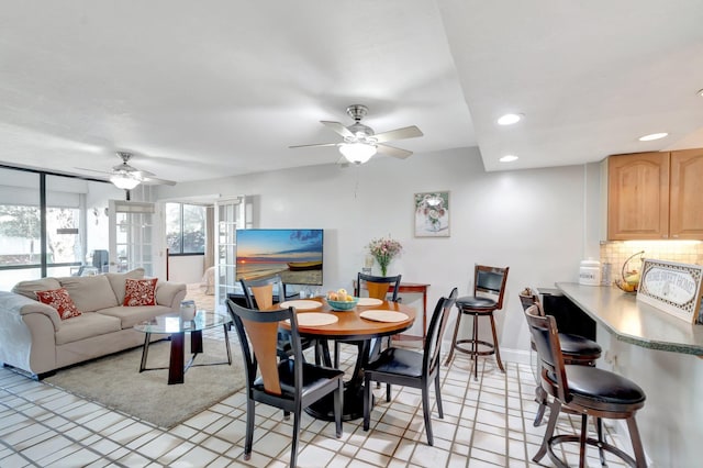 dining area with ceiling fan, recessed lighting, and baseboards