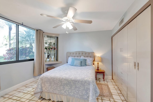 bedroom with baseboards, a closet, and ceiling fan