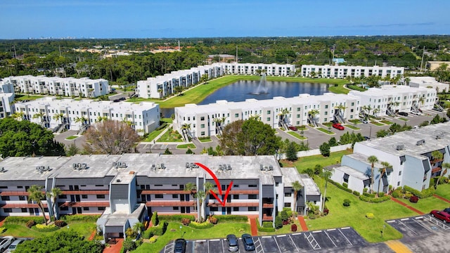 aerial view of apartment complex and a nearby body of water