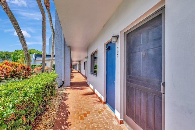 view of exterior entry featuring stucco siding