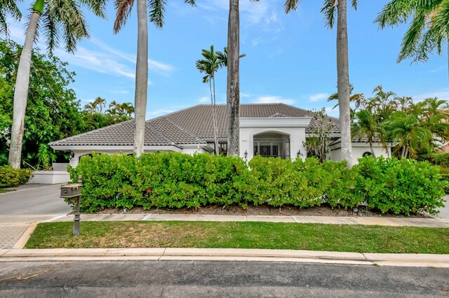 2393 NW 59th St, Boca Raton, FL 33496 - view of property exterior with stucco siding and a tile roof