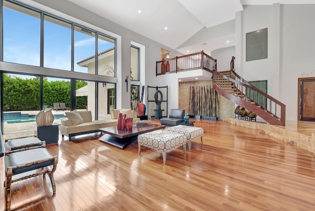 2393 NW 59th St, Boca Raton, FL 33496 - living area with recessed lighting, stairs, wood finished floors, and high vaulted ceiling