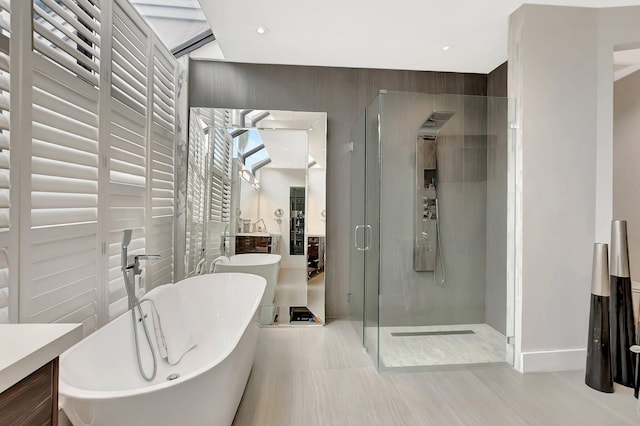 2393 NW 59th St, Boca Raton, FL 33496 - bathroom featuring a freestanding bath, vanity, baseboards, and a shower stall