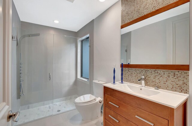 2393 NW 59th St, Boca Raton, FL 33496 - full bath featuring vanity, toilet, tasteful backsplash, and a stall shower
