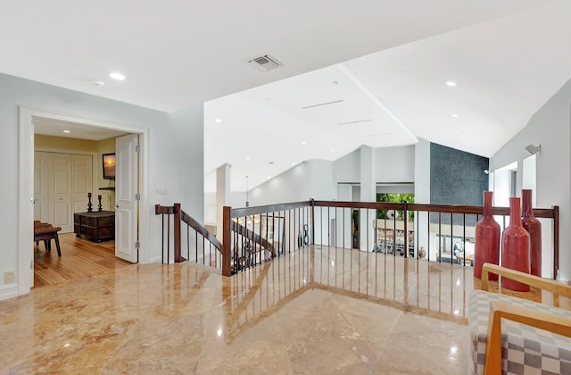 2393 NW 59th St, Boca Raton, FL 33496 - hall with lofted ceiling, marble finish floor, an upstairs landing, and visible vents