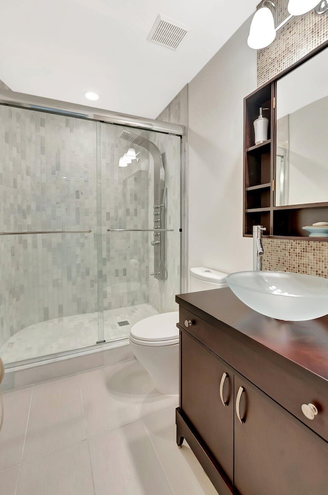 2393 NW 59th St, Boca Raton, FL 33496 - full bathroom featuring a stall shower, toilet, visible vents, tile patterned floors, and vanity