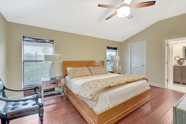 2393 NW 59th St, Boca Raton, FL 33496 - bedroom featuring lofted ceiling, wood finished floors, ensuite bath, a ceiling fan, and baseboards