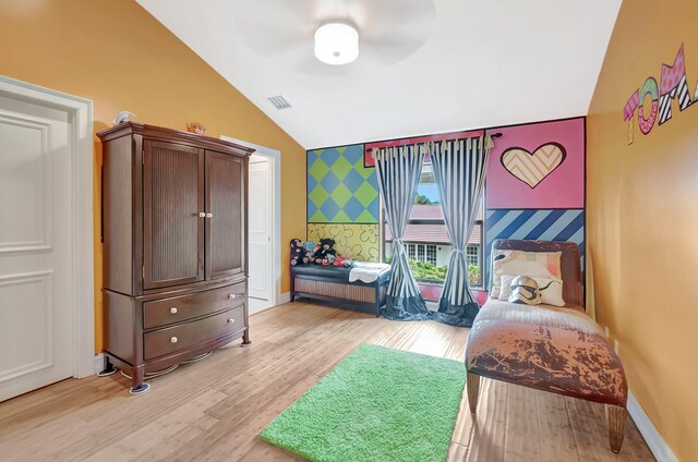 2393 NW 59th St, Boca Raton, FL 33496 - bedroom with lofted ceiling, light wood-type flooring, visible vents, an accent wall, and wallpapered walls