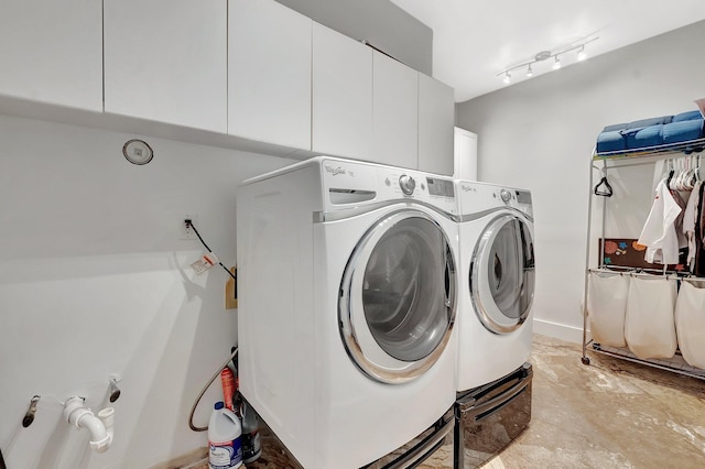 2393 NW 59th St, Boca Raton, FL 33496 - washroom featuring washer and clothes dryer and cabinet space