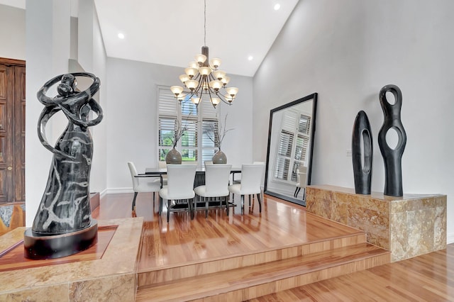 2393 NW 59th St, Boca Raton, FL 33496 - dining room with an inviting chandelier, recessed lighting, high vaulted ceiling, and wood finished floors