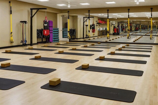 2393 NW 59th St, Boca Raton, FL 33496 - exercise room featuring baseboards and wood finished floors