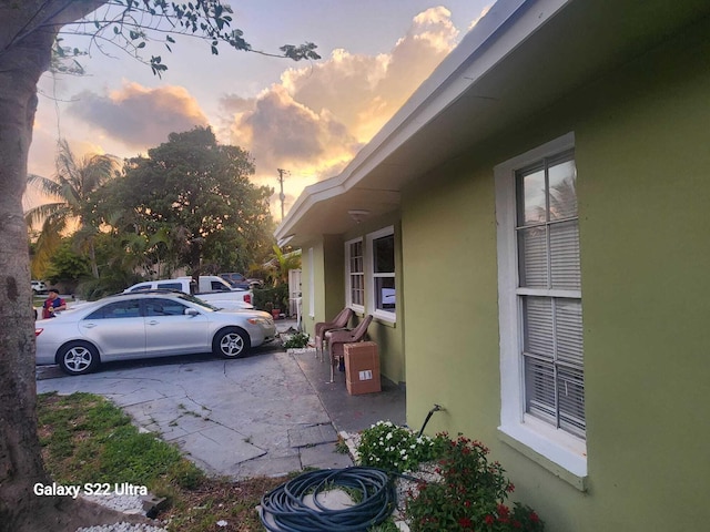 1441 W Central St, Lantana, FL 33462 - property exterior at dusk featuring stucco siding and a patio