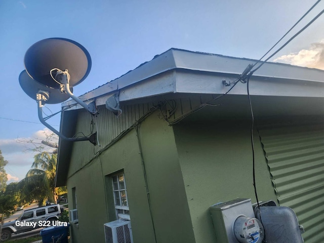 1441 W Central St, Lantana, FL 33462 - exterior view of cooling unit, stucco siding, and electric meter