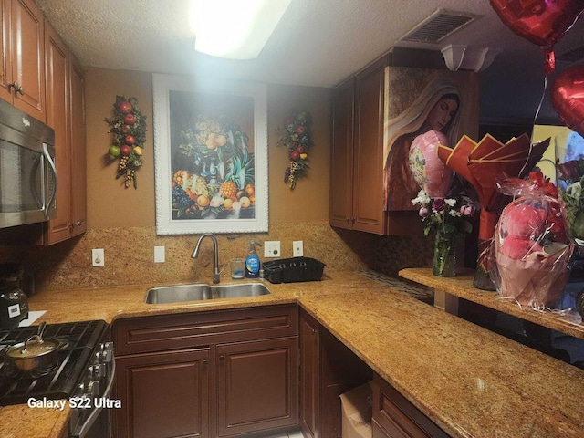 1441 W Central St, Lantana, FL 33462 - kitchen with a sink, stainless steel appliances, and backsplash