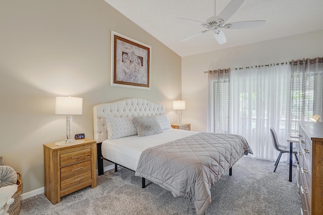 bedroom featuring vaulted ceiling, light colored carpet, and ceiling fan