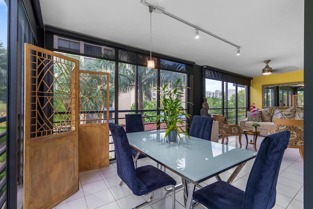 sunroom / solarium with tile patterned floors