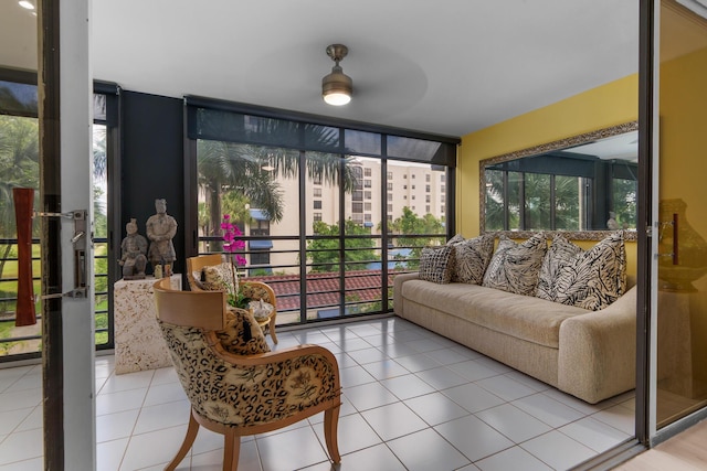 sunroom / solarium featuring floor to ceiling windows and tile patterned flooring