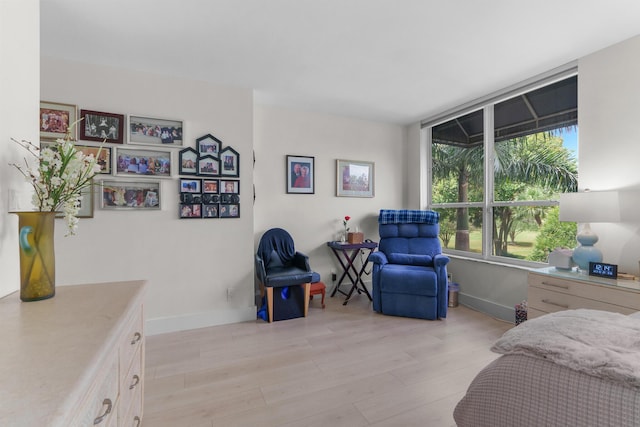 bedroom featuring light wood-type flooring and baseboards