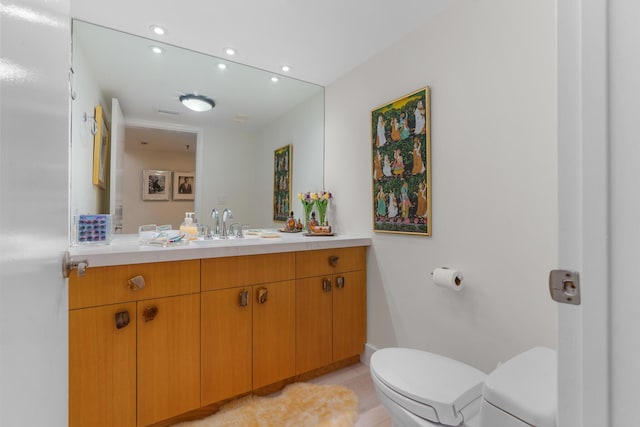 bathroom with toilet, recessed lighting, vanity, and tile patterned flooring