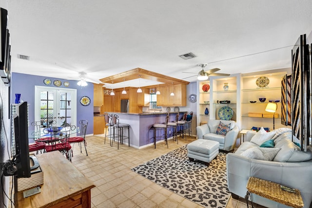 848 Johnson St, Hollywood, FL 33019 - living area with light floors, a ceiling fan, and visible vents