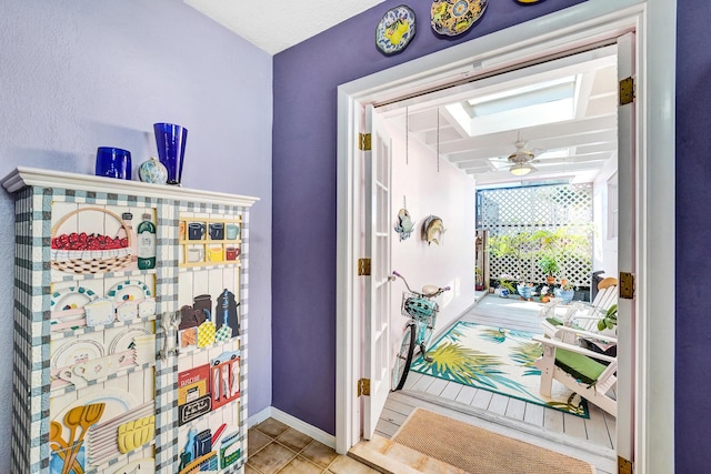 848 Johnson St, Hollywood, FL 33019 - interior space with tile patterned flooring, a skylight, and baseboards