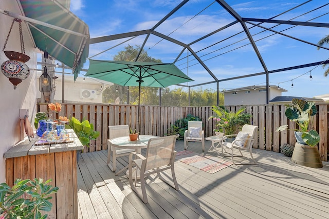 848 Johnson St, Hollywood, FL 33019 - wooden deck featuring fence, outdoor dining space, and glass enclosure