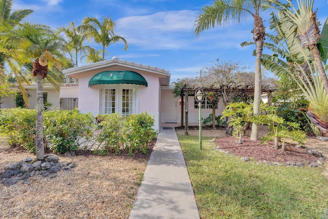 848 Johnson St, Hollywood, FL 33019 - view of front of house featuring stucco siding and french doors