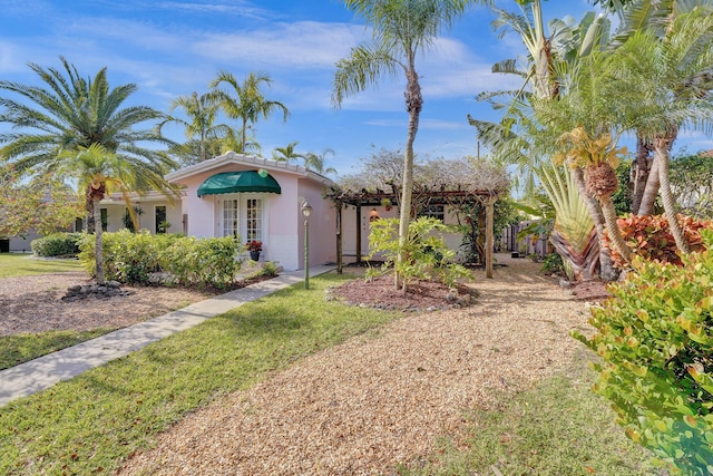 848 Johnson St, Hollywood, FL 33019 - view of front of property featuring stucco siding, french doors, and a front yard