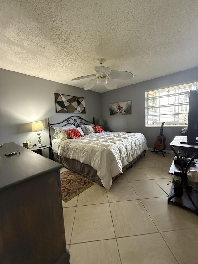 462 Normandy J, Delray Beach, FL 33484 - bedroom with ceiling fan, a textured ceiling, and light tile patterned floors