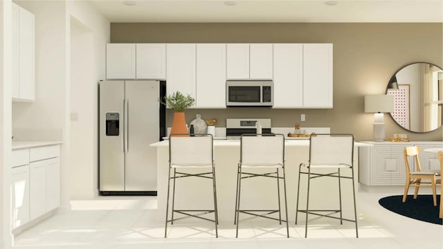 1531 Stockbridge St, Loxahatchee, FL 33470 - kitchen with stainless steel microwave, a breakfast bar, white fridge with ice dispenser, white cabinetry, and electric stove