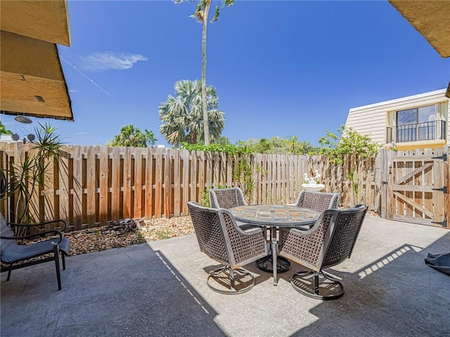 view of patio / terrace featuring a fenced backyard and outdoor dining area
